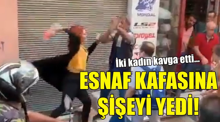 Ayırmak isteyen esnaf kafasına şişeyi yedi!