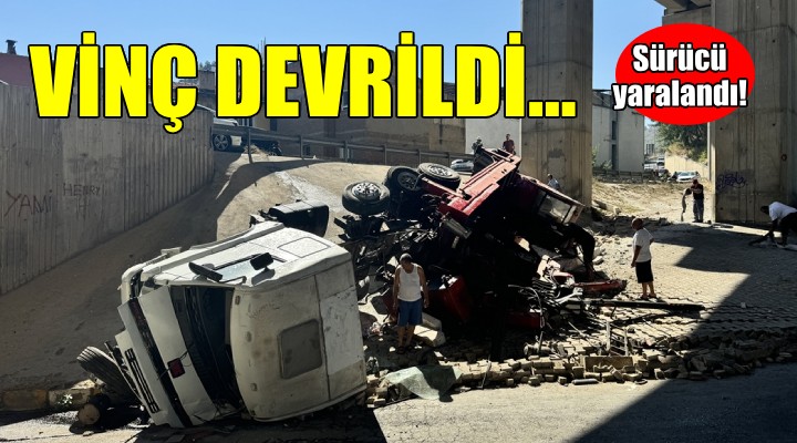 İzmir'de devrilen vincin sürücüsü yaralandı