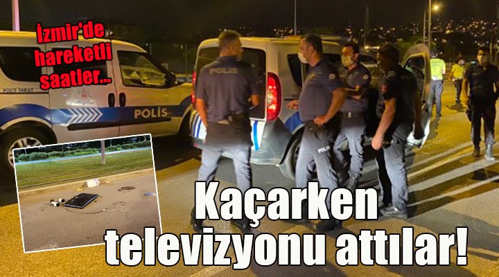 İzmir'de hareketli saatler... Kaçarken televizyonu arabadan attılar!