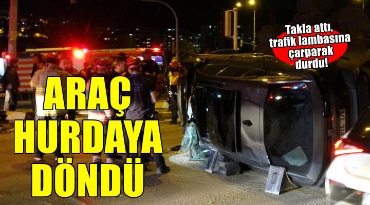 İzmir'de kontrolden çıkarak takla atan otomobil, trafik lambasına çarptı: 1 yaralı